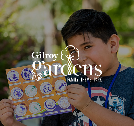 gilroy gardens - boy holding poster