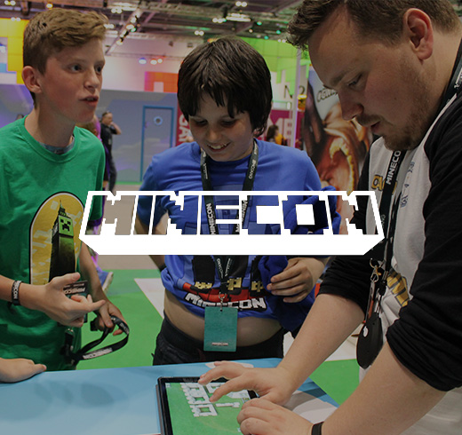 two kids and a man at a minecon event