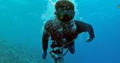 man in scuba diving gear underwater