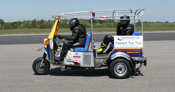 2 men in the Fastest tuk-tuk