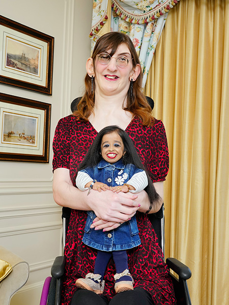 Rumeysa holding Jyoti and smiling