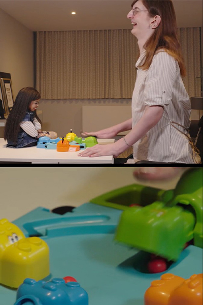 Jyoti and Rumeysa laughing while playing Hungry Hungry Hippos