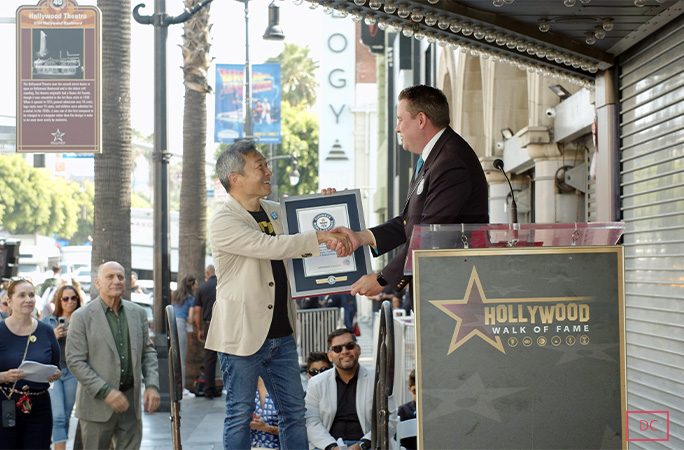 Jim Lees is handed a GWR certificate by Michael Empric