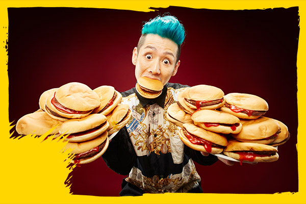 man holding multiple burgers