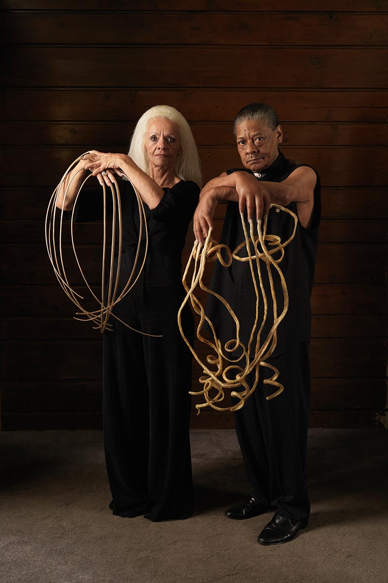 Lee Redmond with Melvin Boothe who holds the record for the longest fingernails on a male