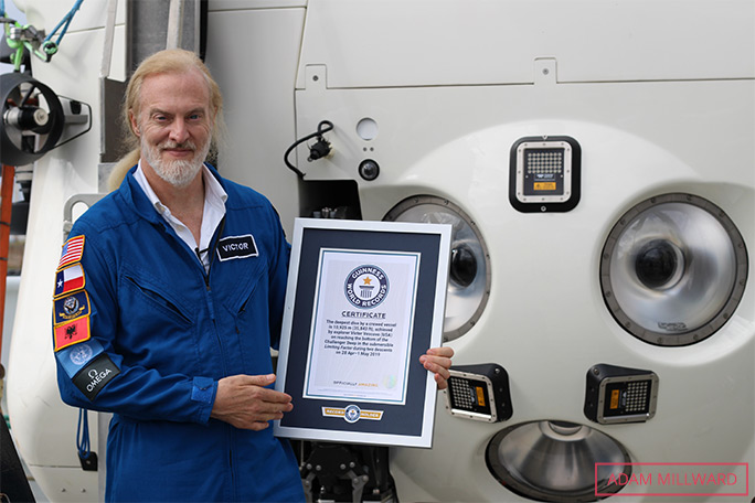 Victor holding his GWR certificate with limiting factor submersible 