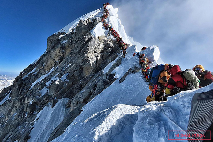 traffic jam of climbers on summit of everest 