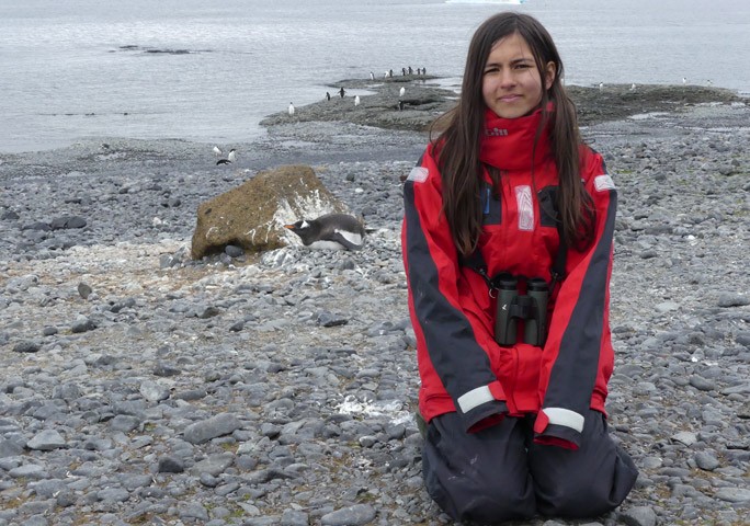 Mya Chilling out with penguins in Antarctica