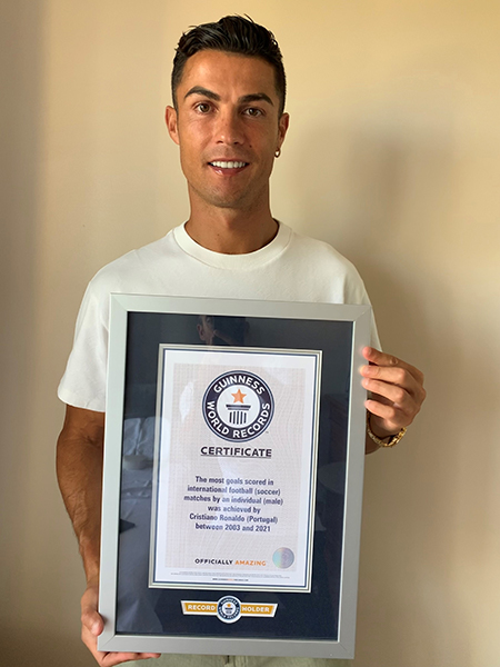 Ronaldo holding certificate