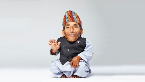 Shortest man smiling